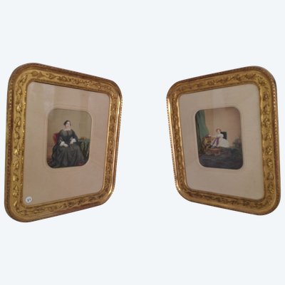 pair of colorized photos, family portraits framed in gold leaf