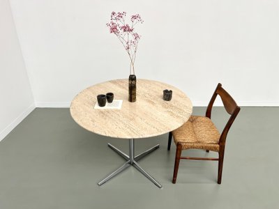 Round travertine marble dining table with chrome base, 1970s.