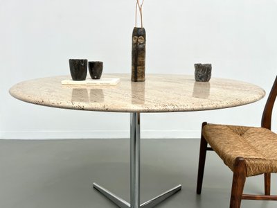 Round travertine marble dining table with chrome base, 1970s.