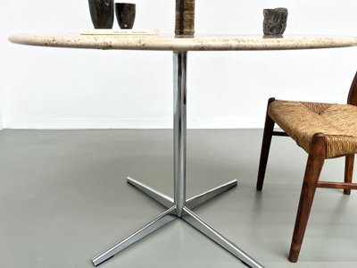 Round travertine marble dining table with chrome base, 1970s.