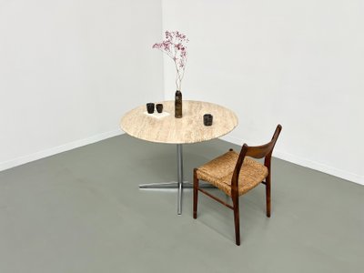 Round travertine marble dining table with chrome base, 1970s.