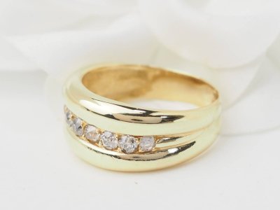 Yellow gold and diamond bangle ring