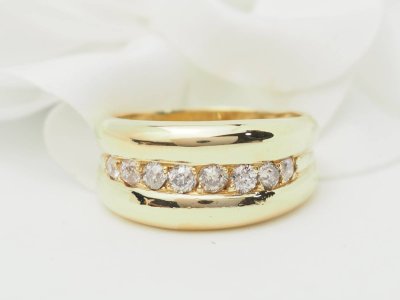 Yellow gold and diamond bangle ring