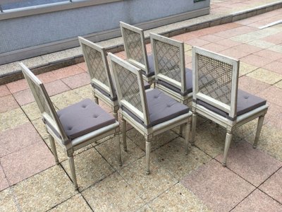 Set of six Louis XVI caned chairs in rechampi wood.