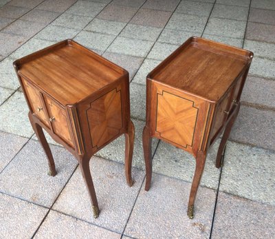 A Pair of Louis XV Style Marquetry Bedside Tables