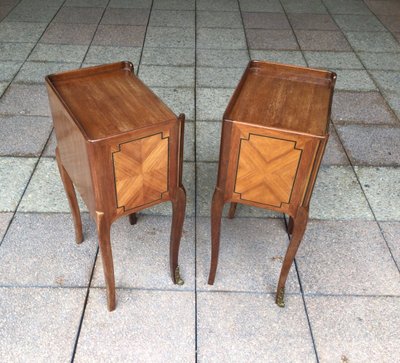 A Pair of Louis XV Style Marquetry Bedside Tables