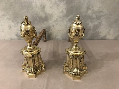 Pair of antique bronze andirons from the 19th century in Louis XVI style