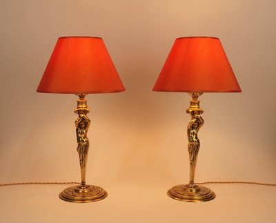 Pair of bronze "Atlantean" lamps