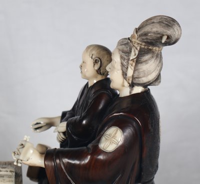 Okimono in wood and ivory, Meiji period Japan