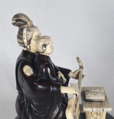 Okimono in wood and ivory, Meiji period Japan