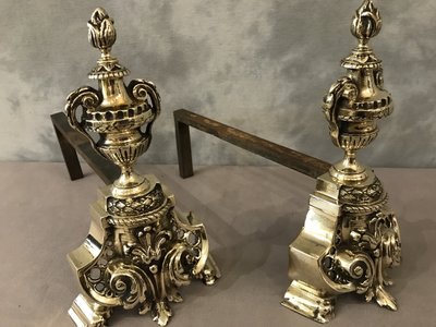 Pair of antique bronze andirons from the 19th century in Louis XV / Louis XVI style