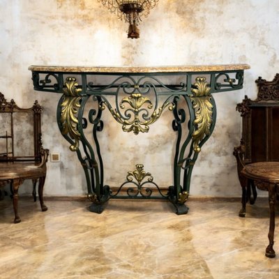 CONSOLLE IN FERRO BATTUTO CON DECORO FOGLIAME CON PIANO IN MARMO, PERIODO ART DECO