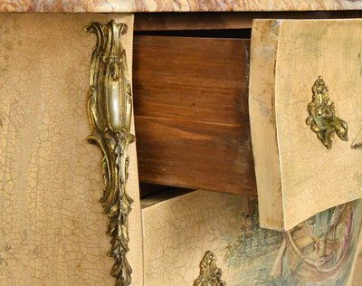 Louis XV style chest of drawers in lacquered wood with polychrome Chinese decoration on a beige background