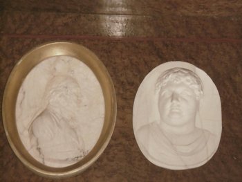 Two marble medallions