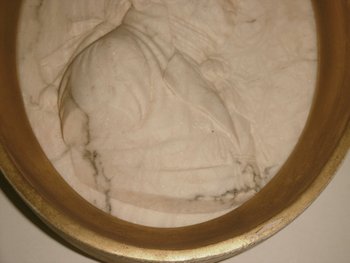 Two marble medallions