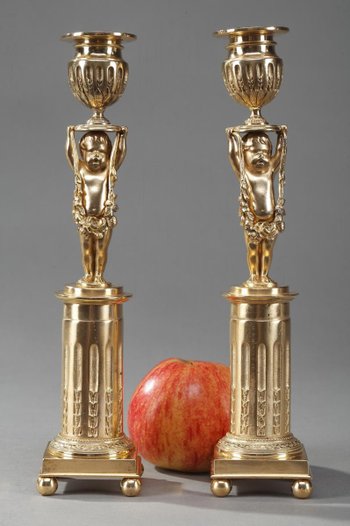 Gilded Bronze Pedestal Candleholders with Putti decoration, 19th Century