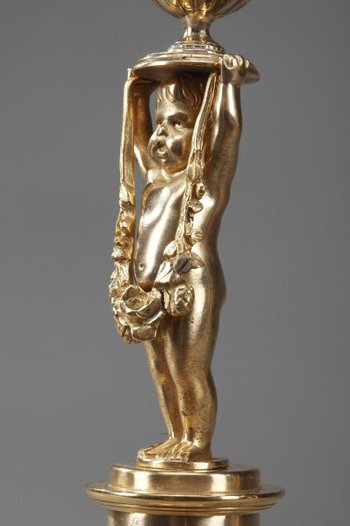 Gilded Bronze Pedestal Candleholders with Putti decoration, 19th Century