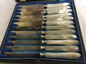 12 silver and mother-of-pearl dessert knives