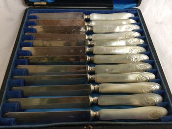 12 silver and mother-of-pearl dessert knives