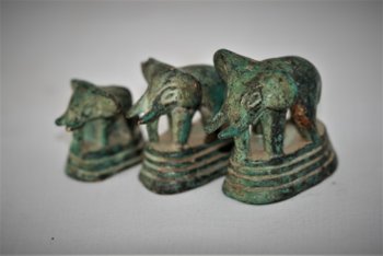 Set of three small opium weights, Siam.