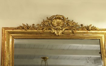 Grand miroir en bois et stuc doré, XIXème siècle 