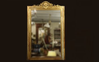 Grand miroir en bois et stuc doré, XIXème siècle 