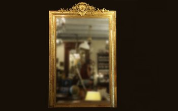 Grand miroir en bois et stuc doré, XIXème siècle 