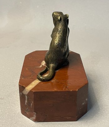 Mouse with a pear. Bronze sculpture from the 19th century