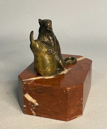 Mouse with a pear. Bronze sculpture from the 19th century