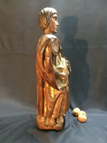 Holy man with a book, 17th century statue