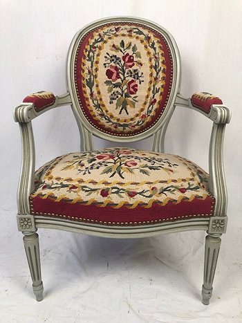 Louis XVI style armchair in gray lacquered wood, medallion backrest, upholstered with petit point tapestry