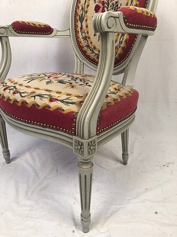 Louis XVI style armchair in gray lacquered wood, medallion backrest, upholstered with petit point tapestry