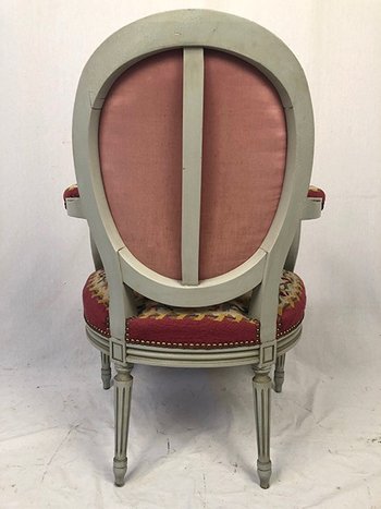 Louis XVI style armchair in gray lacquered wood, medallion backrest, upholstered with petit point tapestry