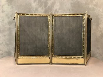 Pressed brass fireback from the 19th century with headband