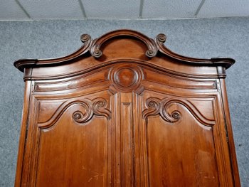 Louis XV period Cauchoise cabinet with gendarme hat in solid pine around 1750