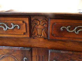 Sideboard with 2 drawers and 2 doors in molded walnut. Provencal work XVIIIth century