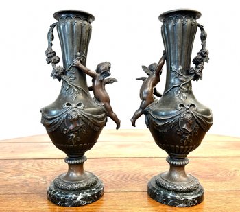 Pair of vases in regula with angel decoration