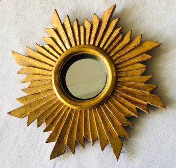 Radiant mirror in gilded wood with 20th century leaf