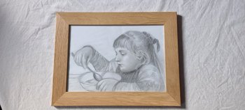 Drawing with gray pencils portrait of a little girl