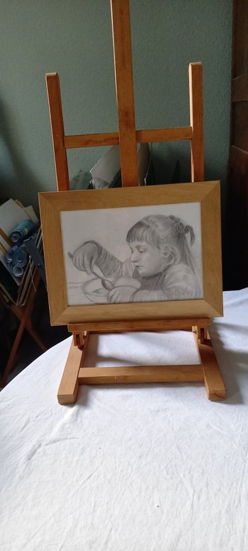 Drawing with gray pencils portrait of a little girl