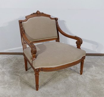 Fauteuil bas en Noyer massif, style Louis XVI – fin XIXe