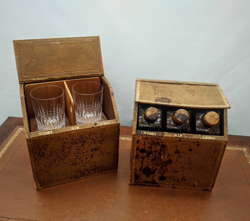 Pair of false book cases, with carafes and glasses.