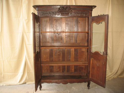 Carved and glazed oak wedding armoire from the 19th century from Normandy