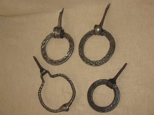 Collection of 4 door knockers from the 17th and 18th century in chiseled wrought iron