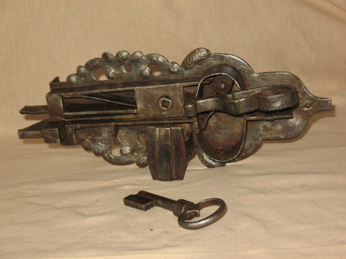 Strong wrought iron lock with its handle and key 17th century