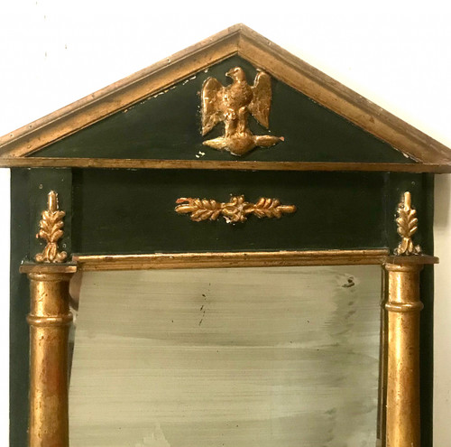 Mirror in gilded and tinted wood in the Empire style of the XIXth century