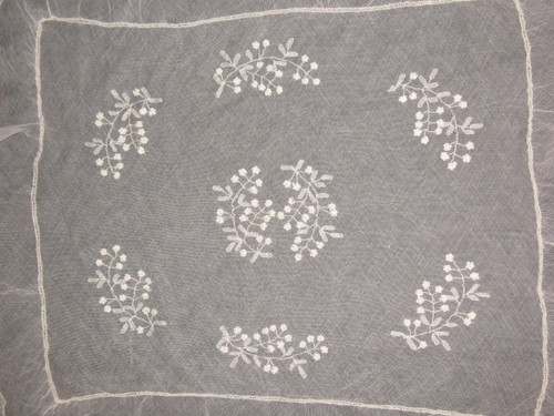 Small tablecloth in white embroidery on tulle, 19th century