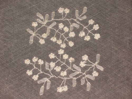 Small tablecloth in white embroidery on tulle, 19th century