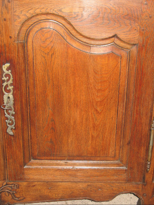 Low sideboard in molded and carved oak in the Louis XV style, 19th century