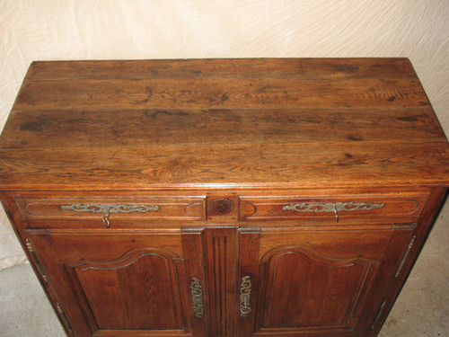 Low sideboard in molded and carved oak in the Louis XV style, 19th century